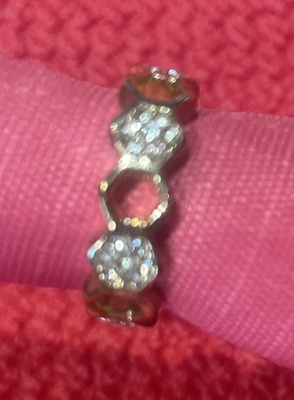 Adjustable Gold Ring, white crystals, band perforated with holes.  Size 6.